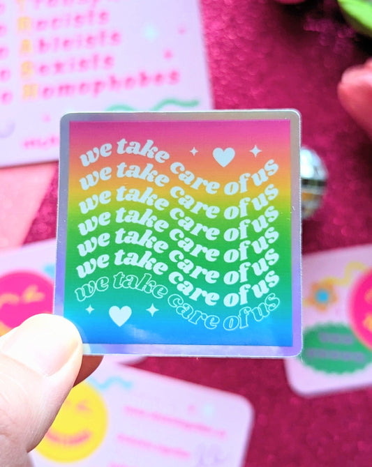 We Take Care of Us Holographic Sticker
