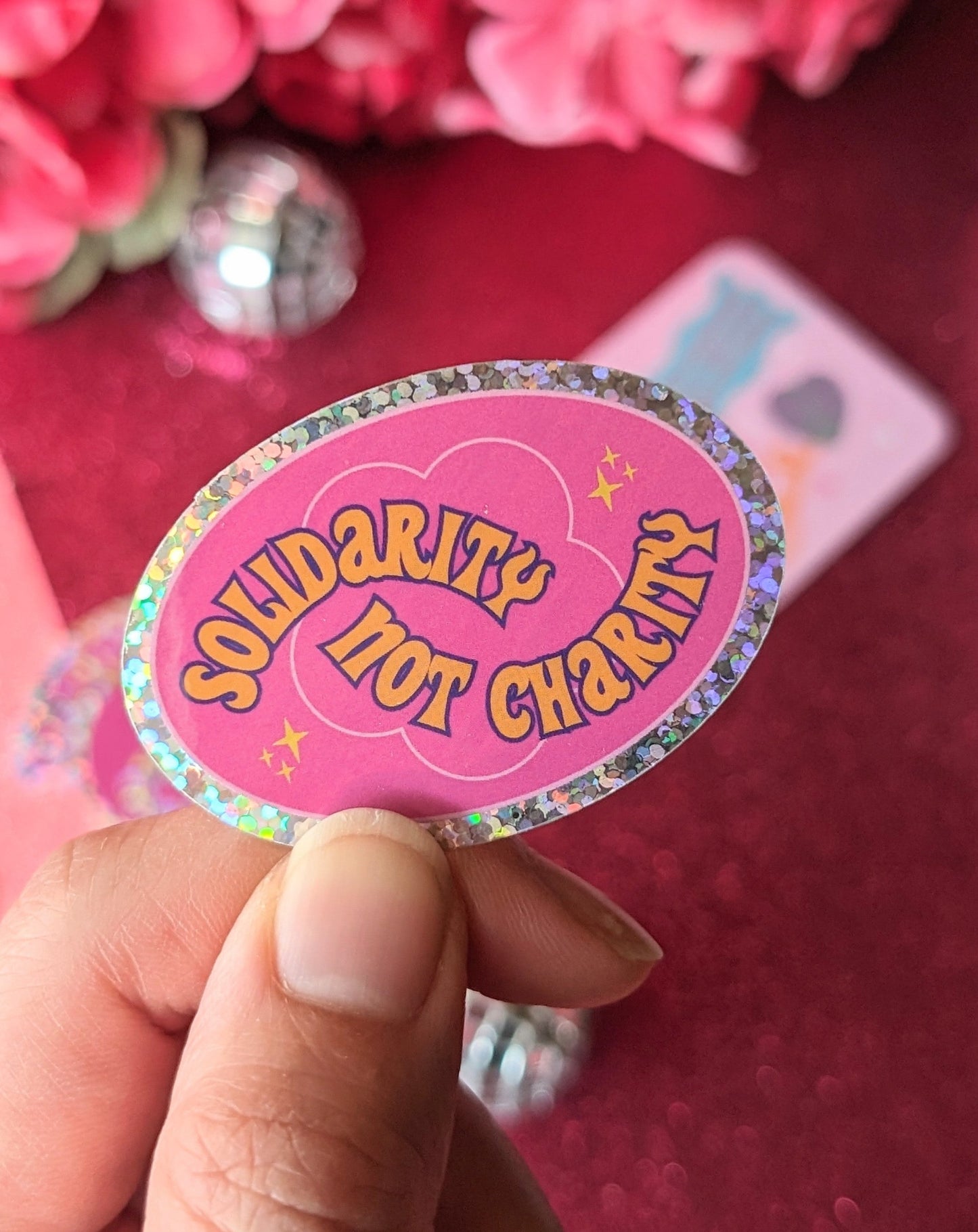 Solidarity Over Charity Glitter Sticker